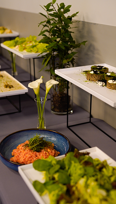 Black and white photo of a women performing modern dance on a dark background.
