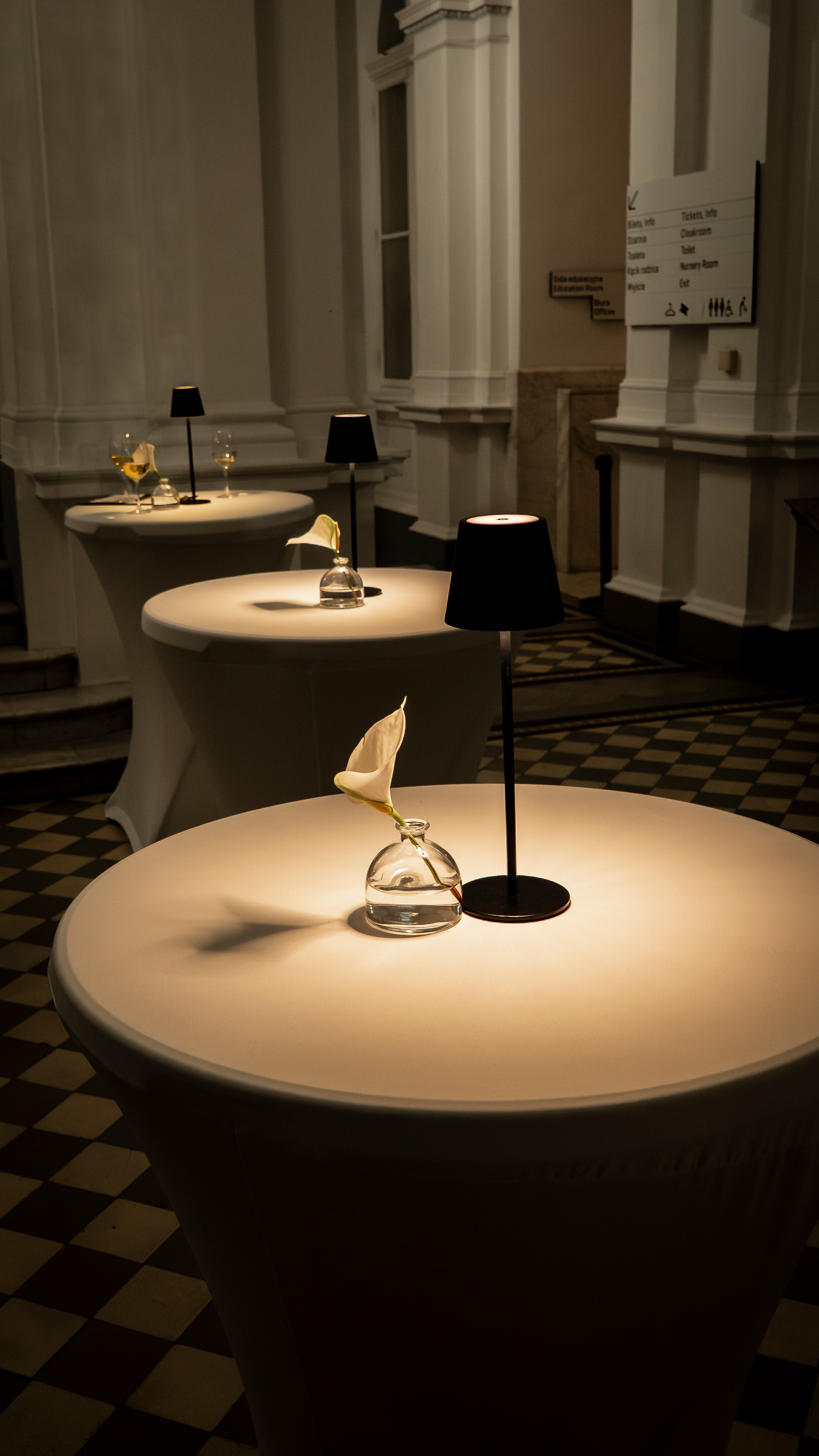 Black and white photo of a women performing modern dance on a dark background.