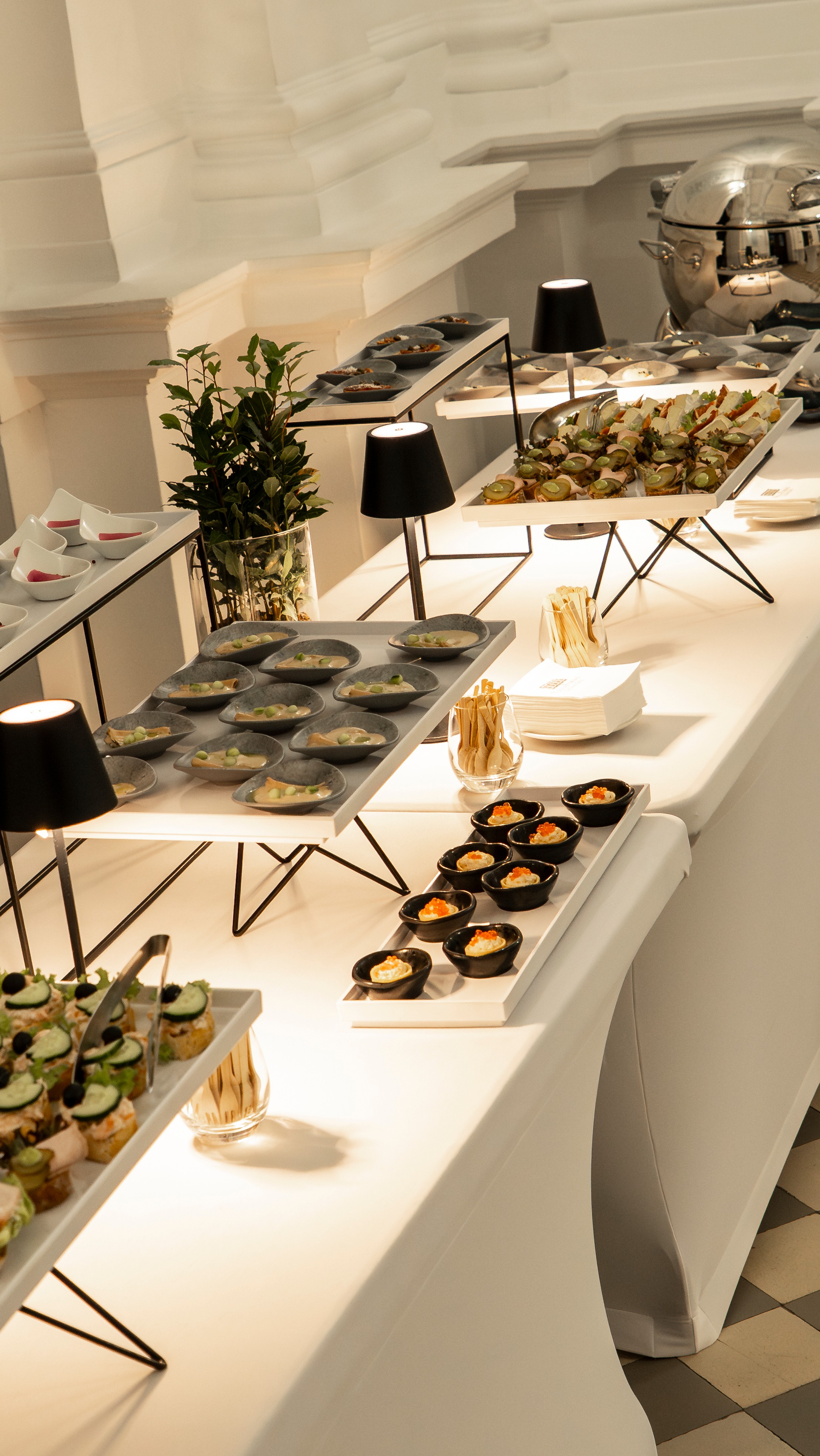 Black and white photo of a women performing modern dance on a dark background.
