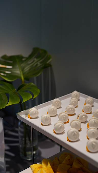 Black and white photo of a women performing modern dance on a dark background.