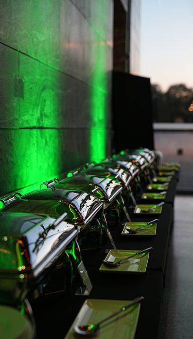 Black and white photo of a women performing modern dance on a dark background.