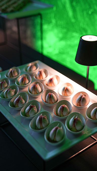 Black and white photo of a women performing modern dance on a dark background.