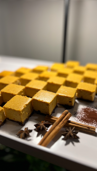 Black and white photo of a women performing modern dance on a dark background.