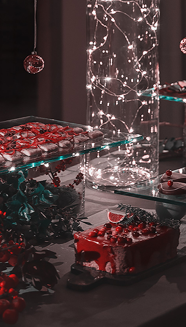 Black and white photo of a women performing modern dance on a dark background.