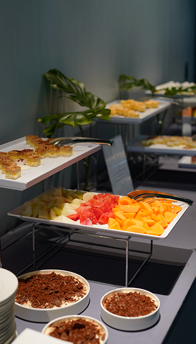 Black and white photo of a women performing modern dance on a dark background.