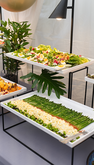 Black and white photo of a women performing modern dance on a dark background.