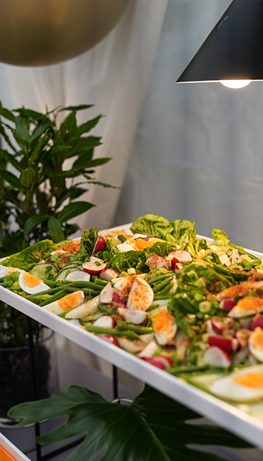 Black and white photo of a women performing modern dance on a dark background.